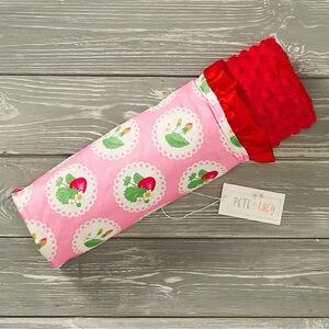 Keeping your little one warm and comfortable with a pink strawberry blanket